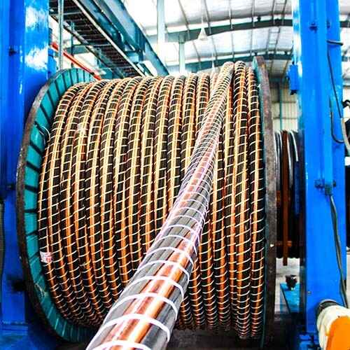A large coil of wire in a factory.-6